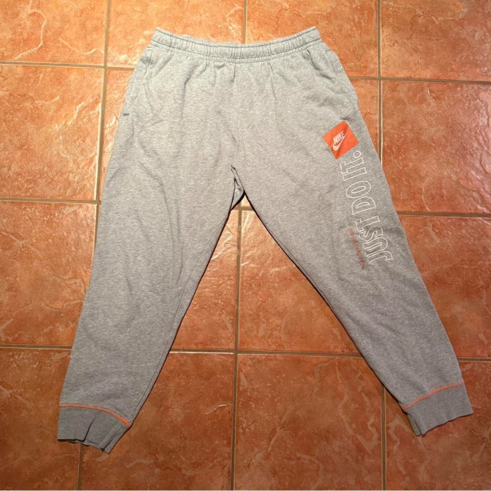 Nike Men's Light Gray Joggers with Orange Accents